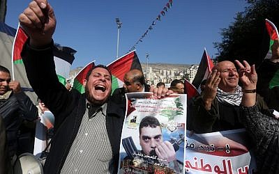 Illustrative: Palestinians chant slogans against Israel during a demonstration in support of late Lebanese terrorist Samir Kantar (portrait) in the West Bank city of Nablus on December 21, 2015. (AFP/JAAFAR ASHTIYEH)