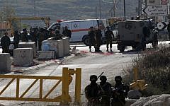 Illustrative: Israeli security forces in Hebron on December 24, 2015. (AFP Photo/Hazem Bader)