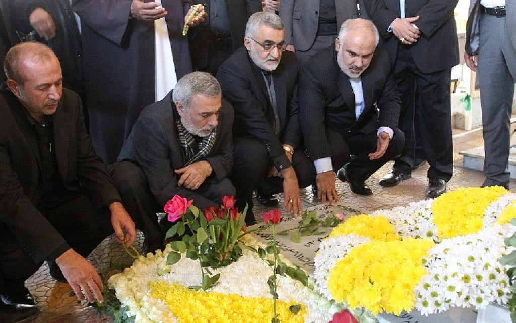 The Chairman of Foreign Policy and National Security Committee of Iran's parliament, Alaeddin Boroujerdi, 2nd right, and Hussain Shaikh Al-Islam, adviser to the head of the Iranian Shoura council, visits the grave of Samir Kuntar, a senior figure in terror group Hezbollah on December 27, 2015. (AFP/ANWAR AMRO)