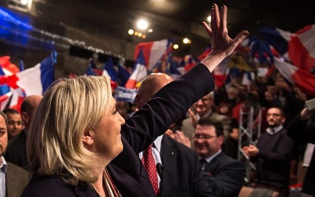 Marine Le Pen, leader of the French far-right Front National (FN) party, waves to supporters during her campaign rally for the upcoming regional elections in the Nord pas de Calais-Picardie, on November 30, 2015 in Lille, northern France, ahead of the December 6 and December 13 French regional elections. (AFP PHOTO / PHILIPPE HUGUEN) Marine Le Pen, leader of the French far-right Front National (FN) party, waves to supporters during her campaign rally for the upcoming regional elections in the Nord pas de Calais-Picardie, on November 30, 2015 in Lille, northern France, ahead of the December 6 and December 13 French regional elections. (AFP PHOTO / PHILIPPE HUGUEN)