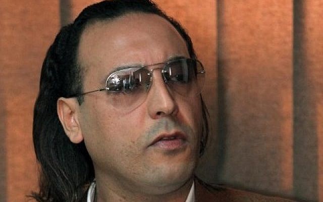 A file picture taken on March 1, 2010 shows Hannibal Gaddafi, a son of the late Libyan dictator Muammar Gaddafi, speaking to a jailed Swiss businessman during a meeting at Al-Jadaida prison on the outskirts of Tripoli. (AFP PHOTO / MAHMUD TURKIA) A file picture taken on March 1, 2010 shows Hannibal Gaddafi, a son of the late Libyan dictator Muammar Gaddafi, speaking to a jailed Swiss businessman during a meeting at Al-Jadaida prison on the outskirts of Tripoli. (AFP PHOTO / MAHMUD TURKIA)