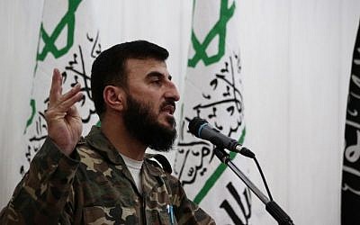 A file picture taken June 25, 2014 shows Zahran Allouch, the leader of Jaish al-Islam (Islam Army), speaking during a press conference in the rebel-held Eastern Ghouta region outside the capital Damascus. (Abd Doumany/AFP)