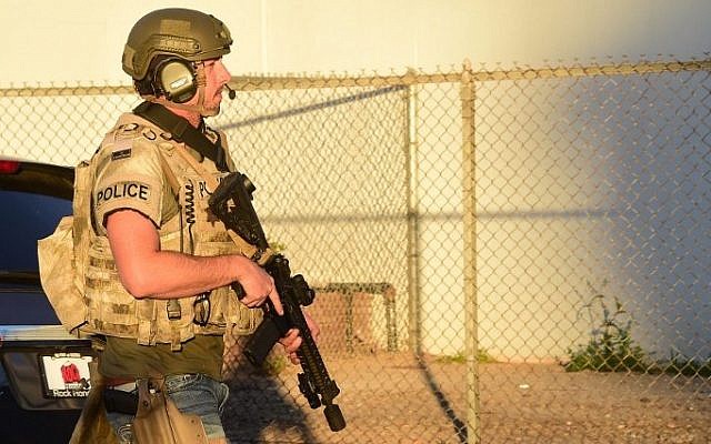 Armed police personnel walk along closed off streets in the San Bernardino neighborhood on December 2, 2015 (Frederic J. Brown/AFP) Armed police personnel walk along closed off streets in the San Bernardino neighborhood on December 2, 2015 (Frederic J. Brown/AFP)