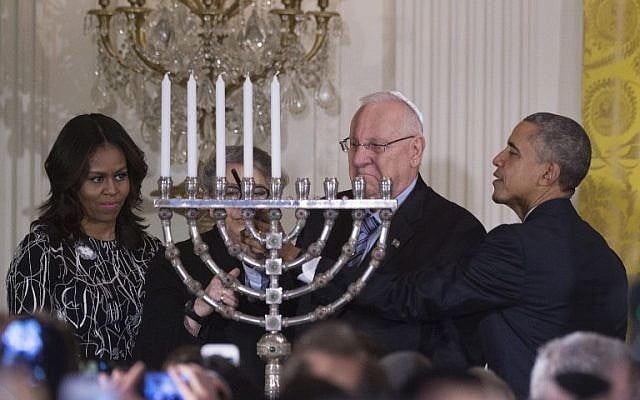 US President Barack Obama helps Israeli President Reuven Rivlin light the menorah during a Hanukkah reception at the White House in Washington, DC, December 9, 2015. (Photo by AFP Photo/Jim Watson) US President Barack Obama helps Israeli President Reuven Rivlin light the menorah during a Hanukkah reception at the White House in Washington, DC, December 9, 2015. (Photo by AFP Photo/Jim Watson)