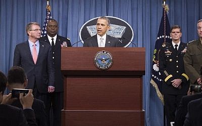 US President Barack Obama, center, speaks to reporters following a National Security Council meeting on the counter-Islamic State program at the Pentagon in Washington, DC, December 14, 2015. (AFP/Jim Watson)