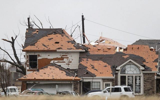 A house is damaged after a night tornado in Garland, Texas on December 27, 2015. (Photo by AFP Photo/Laura Buckman)