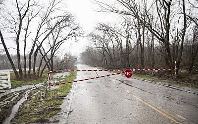 Barnes Bridge road is closed after a night tornado in Garland, Texas on December 27, 2015. (Photo by AFP Photo/Laura Buckman)