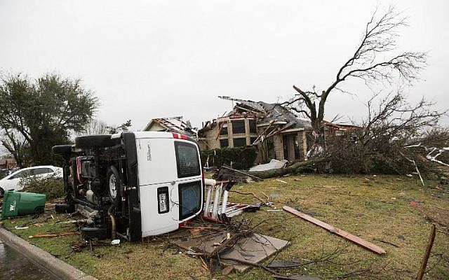 A heavily damaged area is seen December 27, 2015 in the aftermath of a tornado in Rowlett, Texas.  (Photo by AFP Photo/Laura Buckman)