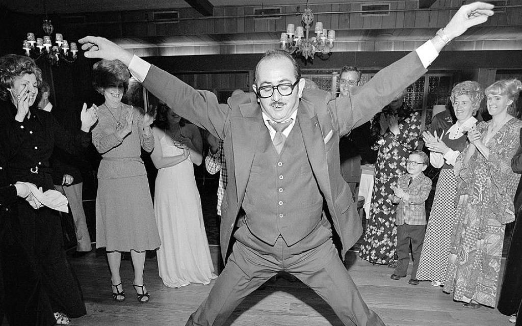 Man in a 3 Piece Suit Dancing Within the Circle at a Wedding, Rockville Centre, NY, March 1976 (Detail) © Meryl Meisler Photography