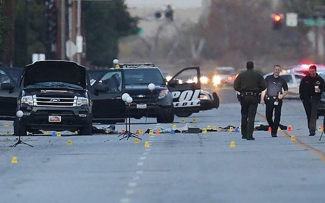 Law enforcement officials continue their investigation around the Ford SUV vehicle that was the scene where suspects of the shooting at the Inland Regional Center were killed, on December 4, 2015 in San Bernardino, California. (Joe Raedle/Getty Images/AFP) Law enforcement officials continue their investigation around the Ford SUV vehicle that was the scene where suspects of the shooting at the Inland Regional Center were killed, on December 4, 2015 in San Bernardino, California. (Joe Raedle/Getty Images/AFP)