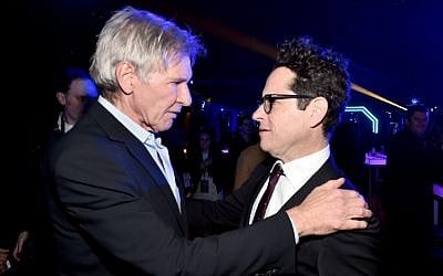 Actor Harrison Ford (L) and director J.J. Abrams attend the after party for the World Premiere of 'Star Wars: The Force Awakens' on Hollywood Blvd on December 14, 2015 in Hollywood, California. (Alberto E. Rodriguez/Getty Images for Disney/AFP)