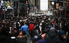 People gather for the New Year's Eve celebrations on December 31, 2015 in New York City. (Eduardo Munoz Alvarez/Getty Images/AFP)