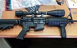 An M-16 with telescope sight sold to a police undercover agent who revealed a ring of criminals operating in the ultra-Orthodox Mea Shearim neighborhood of Jerusalem and in Ramat Beit Shemesh, an ultra-Orthodox offshoot of Beit Shemesh. (Israel Police)