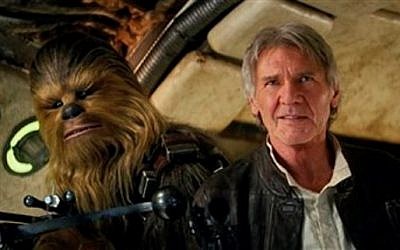 This photo provided by Lucasfilm shows Peter Mayhew as Chewbacca and Harrison Ford as Han Solo in 'Star Wars: The Force Awakens.' (Film Frame/Lucasfilm via AP)