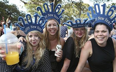 Woman celebrate the coming of a new year as they wait for the annual New Years Eve fireworks display in Sydney, Australia, Thursday, December 31, 2015. (AP/Rob Griffith) 