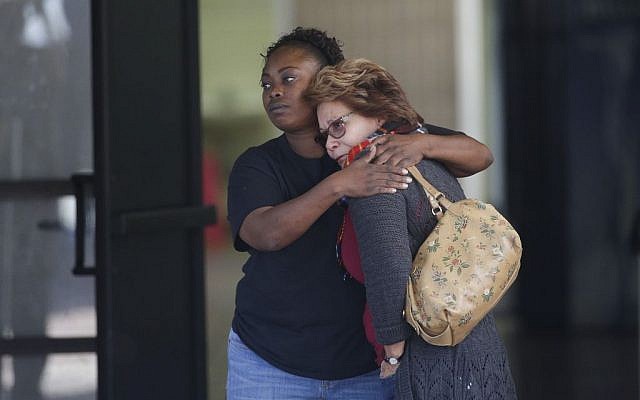 Two women embrace at a community center where family members are gathering to pick up survivors after a shooting rampage that killed multiple people and wounded others at a social services center in San Bernardino, California, Wednesday, Dec. 2, 2015. (AP/Jae C. Hong) Two women embrace at a community center where family members are gathering to pick up survivors after a shooting rampage that killed multiple people and wounded others at a social services center in San Bernardino, California, Wednesday, Dec. 2, 2015. (AP/Jae C. Hong)