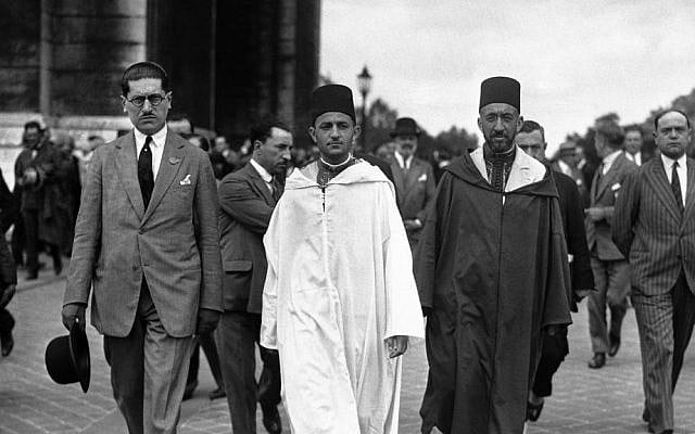 File: Morocco's Mohammed V, wearing white robes, walking with the country's Grand Vizier Si Mohammed El Mokri after he placed a wreath on the Tomb of the Unknown Warrior at the Arc De Triomphe during a visit to Paris, France around July 4, 1930. (AP Photo) File: Morocco's Mohammed V, wearing white robes, walking with the country's Grand Vizier Si Mohammed El Mokri after he placed a wreath on the Tomb of the Unknown Warrior at the Arc De Triomphe during a visit to Paris, France around July 4, 1930. (AP Photo)