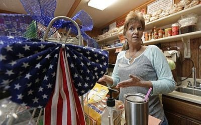 Tracy Hooker talks about Republican presidential candidate Donald Trump at Rosie's Hot Dogs in Greer, S.C., Thursday, Dec. 10, 2015. (AP Photo/Chuck Burton)