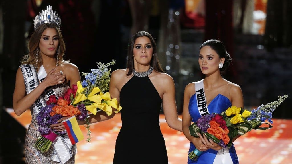 Former Miss Universe Paulina Vega, center, reacts before taking away the flowers, crown and sash from Miss Colombia Ariadna Gutierrez, left, before giving it to Miss Philippines Pia Alonzo Wurtzbach at the Miss Universe pageant Sunday, Dec. 20, 2015, in Las Vegas. (John Locher/AP) Former Miss Universe Paulina Vega, center, reacts before taking away the flowers, crown and sash from Miss Colombia Ariadna Gutierrez, left, before giving it to Miss Philippines Pia Alonzo Wurtzbach at the Miss Universe pageant Sunday, Dec. 20, 2015, in Las Vegas. (John Locher/AP)