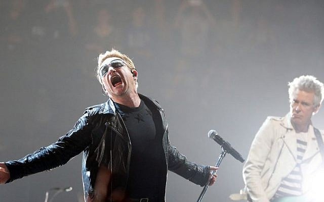 Bono, left, and Adam Clayton of U2 perform on stage during a concert, in Paris, Sunday, Dec. 6, 2015. U2’s performance in Paris on Sunday night wasn’t just about music _ it had a mournful tinge, too. Frontman Bono paid respects to 130 people killed by terrorists in Paris on Nov. 13, and 14 people killed in a mass shooting last week in California. (AP Photo/Thibault Camus) Bono, left, and Adam Clayton of U2 perform on stage during a concert, in Paris, Sunday, Dec. 6, 2015. U2’s performance in Paris on Sunday night wasn’t just about music _ it had a mournful tinge, too. Frontman Bono paid respects to 130 people killed by terrorists in Paris on Nov. 13, and 14 people killed in a mass shooting last week in California. (AP Photo/Thibault Camus)