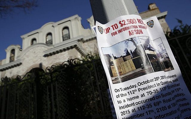 A poster asking for information about a string of arsons is displayed in the Forest Hills section of Queens in New York, Monday, Dec. 7, 2015. Over the past six weeks, an arsonist has torched six buildings in the same tight-knit section of eastern Queens, police say. Police aren't sure whether the victims are being targeted for their religion, their architectural taste, or for no reason at all. (AP Photo/Seth Wenig) A poster asking for information about a string of arsons is displayed in the Forest Hills section of Queens in New York, Monday, Dec. 7, 2015. Over the past six weeks, an arsonist has torched six buildings in the same tight-knit section of eastern Queens, police say. Police aren't sure whether the victims are being targeted for their religion, their architectural taste, or for no reason at all. (AP Photo/Seth Wenig)