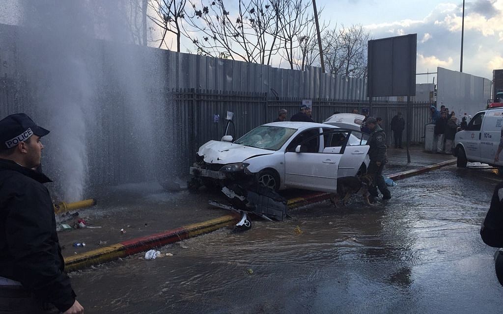 A car that plowed into pedestrians at the entrance to Jerusalem on December 14, 2015 (Israel Police)