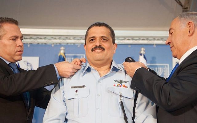 New Police Commissioner Roni Alsheich receives his ranks from Prime Minister Benjamin Netnayahu and Internal Security Minister Gilad Erdan at his swearing in ceremony held at the Prime Minister's Office, December 3, 2015. (Photo by Israel Police) New Police Commissioner Roni Alsheich receives his ranks from Prime Minister Benjamin Netnayahu and Internal Security Minister Gilad Erdan at his swearing in ceremony held at the Prime Minister's Office, December 3, 2015. (Photo by Israel Police)