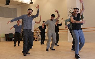 Choreographer Hofesh Shechter, left, with “Fiddler” cast members at New West 42nd Street Studios. (Lindsay Hoffman/Jeffrey Richards Associates) 