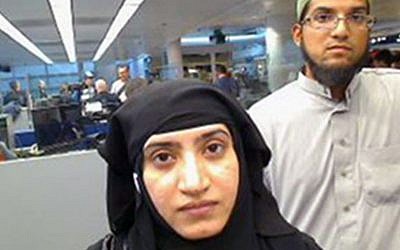 This July 27, 2014 file photo provided by US Customs and Border Protection shows Tashfeen Malik, left, and Syed Farook, as they passed through O'Hare International Airport in Chicago. (US Customs and Border Protection via AP, File)