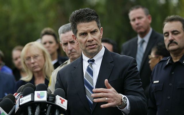 David Bowdich, center, assistant director of the FBI's Los Angeles office, talks to reporters during a news conference Friday, Dec. 4, 2015, in San Bernardino, California. (AP Photo/Jae C. Hong)
