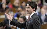 Prime Minister Justin Trudeau answers a question during question period in the House of Commons on Parliament Hill in Ottawa, on Wednesday, Dec. 9, 2015. (Adrian Wyld/The Canadian Press via AP)