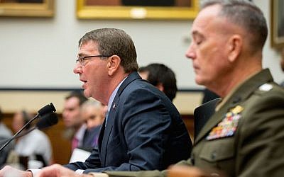 Defense Secretary Ash Carter, left, accompanied by Joint Chiefs Chairman Gen. Joseph Dunford Jr., testifies on Capitol Hill in Washington, Tuesday, Dec. 1, 2015, before the House Armed Services Committee hearing on the US strategy for Syria and Iraq and its implications for the region. (AP Photo/Andrew Harnik)