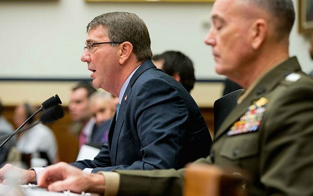 US Defense Secretary Ash Carter, left, accompanied by Joint Chiefs Chairman Gen. Joseph Dunford Jr., testifies on Capitol Hill in Washington, Tuesday, Dec. 1, 2015, before the House Armed Services Committee hearing on the US strategy for Syria and Iraq and its implications for the region. (AP Photo/Andrew Harnik)