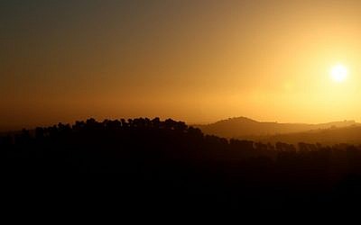 Illustrative image of the sun setting over the Hebron mountains. (Nati Shohat/Flash90, file)