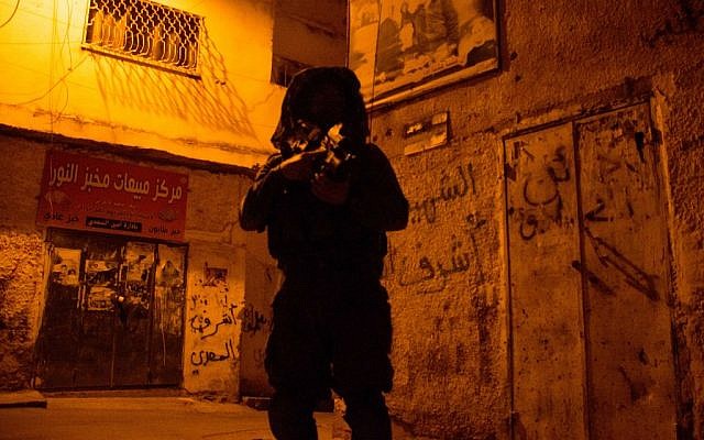 Israeli soldiers seen during searches in the West Bank city of Jenin, June 19, 2014. (IDF /Spokesperson/Flash90) Israeli soldiers seen during searches in the West Bank city of Jenin, June 19, 2014. (IDF /Spokesperson/Flash90)