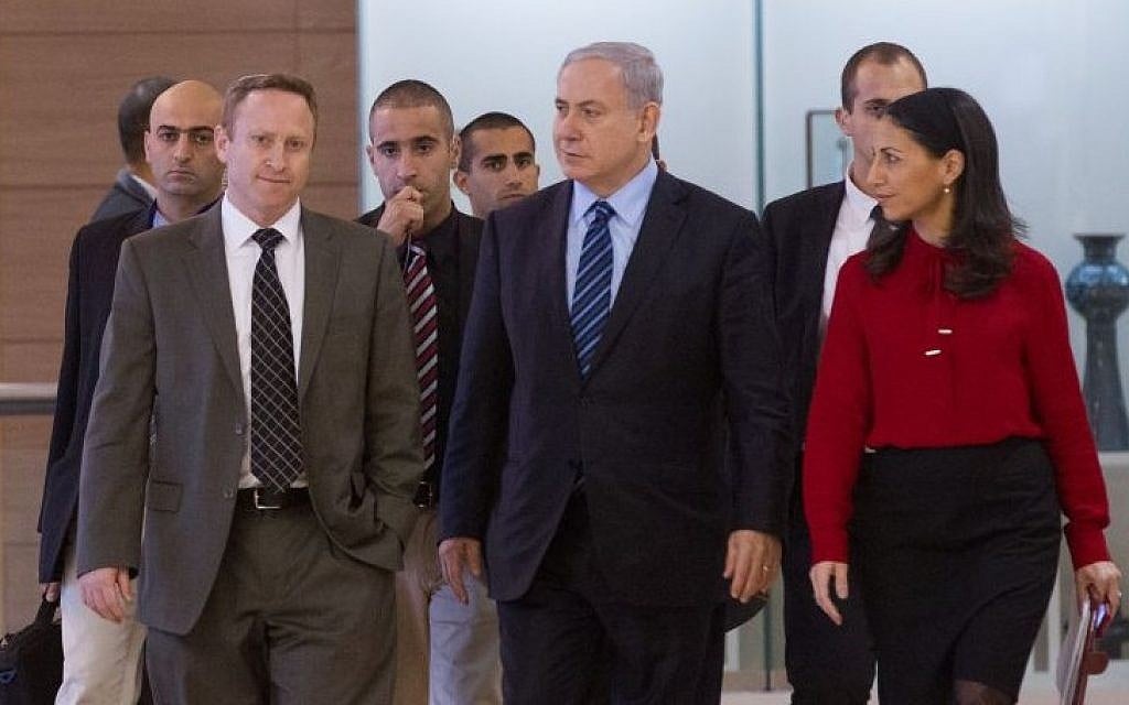 Prime Minister Benjamin Netanyahu flanked by former chief of staff Ari Harow, left, and former parliamentary adviser Perach Lerner, right, as he arrives at a Likud faction meeting in the Israeli parliament, November 24, 2014. (Miriam Alster/Flash90)