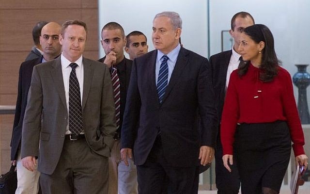 Prime Minister Benjamin Netanyahu flanked by former chief of staff Ari Harow, left, and former parliamentary adviser Perach Lerner, right, as he arrives at a Likud faction meeting in the Israeli parliament, November 24, 2014. (Miriam Alster/Flash90) Prime Minister Benjamin Netanyahu flanked by former chief of staff Ari Harow, left, and former parliamentary adviser Perach Lerner, right, as he arrives at a Likud faction meeting in the Israeli parliament, November 24, 2014. (Miriam Alster/Flash90)