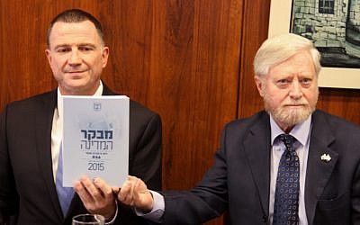 State Comptroller Yosef Shapira (R) hands the State Comptroller's report to chairman of the Israeli parliament Yuli Edelstein on October 28, 2015. (Isaac Harari/ Flash90) State Comptroller Yosef Shapira (R) hands the State Comptroller's report to chairman of the Israeli parliament Yuli Edelstein on October 28, 2015. (Isaac Harari/ Flash90)