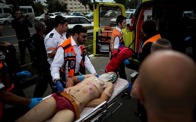 Israeli medics evacuate a Palestinian terrorist after he stabbed two people in an attack near the Ammunition Hill light rail station in Jerusalem, October 30, 2015. Yonatan Sindel/Flash90) Israeli medics evacuate a Palestinian terrorist after he stabbed two people in an attack near the Ammunition Hill light rail station in Jerusalem, October 30, 2015. Yonatan Sindel/Flash90)