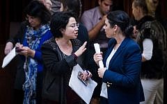 Justice Minister Ayelet Shaked, right, speaks with opposition lawmaker Hanin Zoabi (Joint List) in the Knesset on December 2, 2015. (Miriam Alster/Flash90)