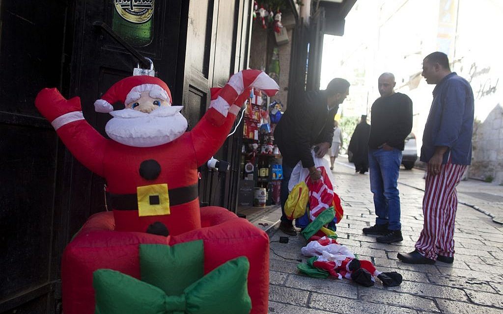 An inflatable Santa Claus at the entrance of a shop in Jerusalem's Old City on December 07, 2015. (Lior Mizrahi/Flash90)