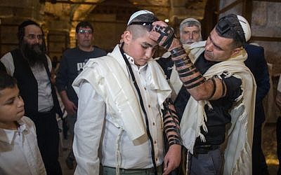 13-year-old Naor Shalev celebrates his bar mitzvah with family and friends at the Western Wall in Jerusalem's Old City, December 17, 2015. (Yonatan Sindel/Flash90)