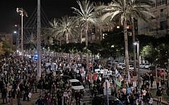 Left-wing demonstrators march in Tel Aviv in protest at right-wing 'incitement,' December 19, 2015. (Tomer Neuberg/Flash90)
