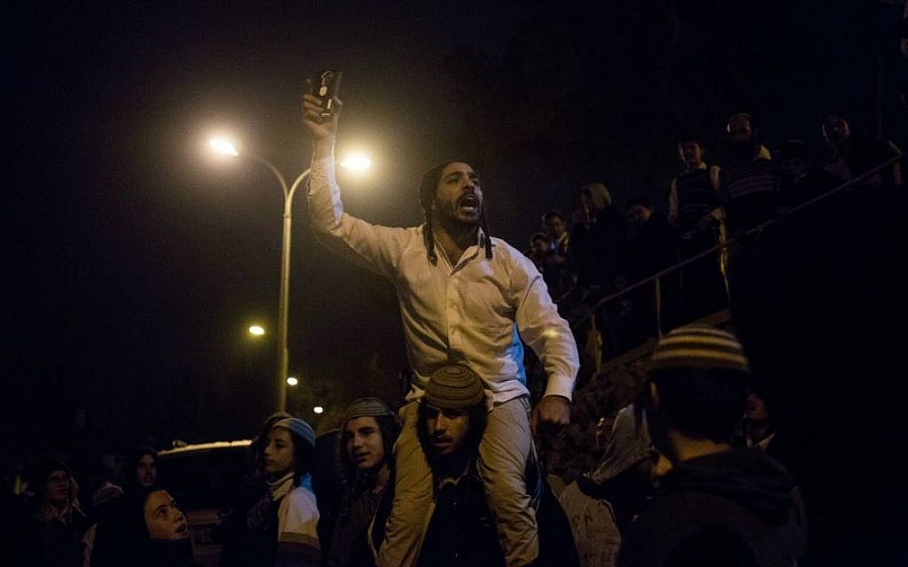 File: A far-right activist shouts slogans against the detention of Jewish terror suspects at a protest near the Jerusalem home of Shin Bet chief Yoram Cohen in Jerusalem, December 19, 2015. (Yonatan Sindel/Flash90)