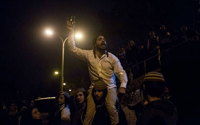 File: A far-right activist shouts slogans against the detention of Jewish terror suspects at a protest near the Jerusalem home of Shin Bet chief Yoram Cohen in Jerusalem, December 19, 2015. (Yonatan Sindel/Flash90) File: A far-right activist shouts slogans against the detention of Jewish terror suspects at a protest near the Jerusalem home of Shin Bet chief Yoram Cohen in Jerusalem, December 19, 2015. (Yonatan Sindel/Flash90)