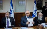 Shas leader Aryeh Deri (left), Prime Minister Benjamin Netanyahu (center) and Health Minister Yaakov Litzman at the weekly cabinet meeting in the Prime Minister's Office, Jerusalem, December 20, 2015. (Yonatan Sindel/Flash90)