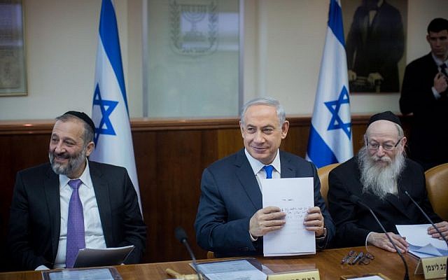 Shas leader Aryeh Deri (left), Prime Minister Benjamin Netanyahu (center) and Health Minister Yaakov Litzman at the weekly cabinet meeting in the Prime Minister's Office, Jerusalem, December 20, 2015. (Yonatan Sindel/Flash90) Shas leader Aryeh Deri (left), Prime Minister Benjamin Netanyahu (center) and Health Minister Yaakov Litzman at the weekly cabinet meeting in the Prime Minister's Office, Jerusalem, December 20, 2015. (Yonatan Sindel/Flash90)