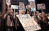 Peace Now activists protest an NGO funding bill proposed by Justice Minister Ayelet Shaked outside her residence in Tel Aviv, December 26, 2015. (Tomer Neuberg/Flash90)