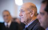 Former prime minister Ehud Olmert speaks to the press at the Supreme Court on December 29, 2015. The court reduced Olmert's sentence to 18 months, following a conviction on corruption charges in the Holyland affair. (Noam Moskowitz/Pool)