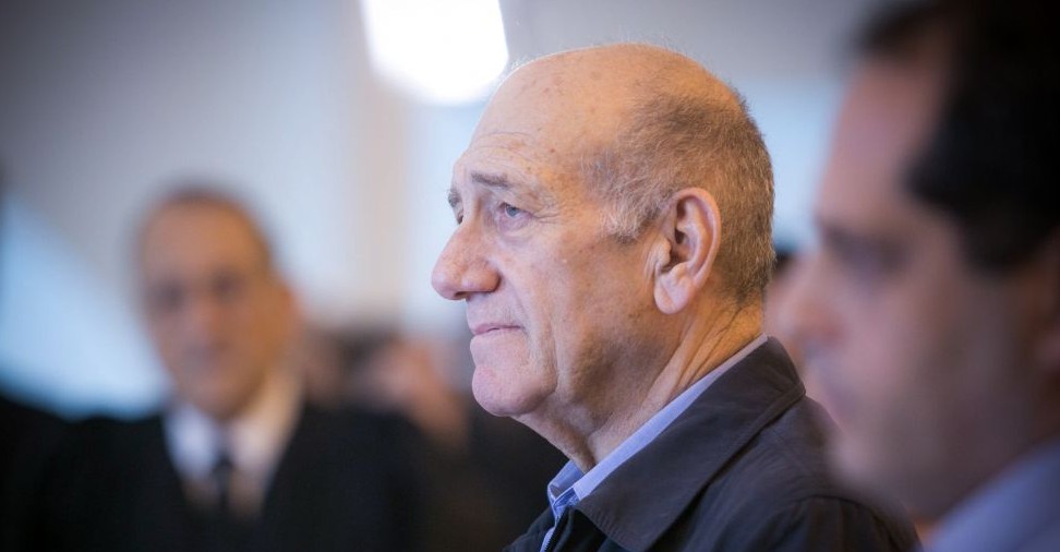 Former prime minister Ehud Olmert speaks to the press at the Jerusalem Supreme Court on December 29, 2015. The court reduced Olmert's sentence to 18 months, following a conviction on corruption charges in the Holyland affair. (Noam Moskowitz/POOL) Former prime minister Ehud Olmert speaks to the press at the Jerusalem Supreme Court on December 29, 2015. The court reduced Olmert's sentence to 18 months, following a conviction on corruption charges in the Holyland affair. (Noam Moskowitz/POOL)